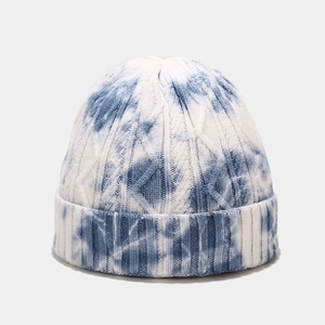 Detailed close-up of blue and white tie-dye knit beanie showing premium wool texture