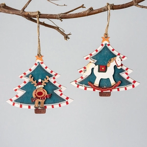 Christmas wooden reindeer and rocking horse tree ornaments on branch with natural texture