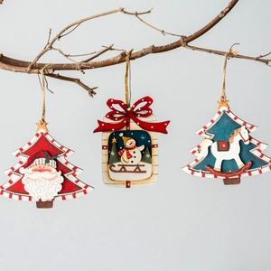Set of three festive wooden Christmas pendants featuring Santa, Snowman, and Rocking Horse