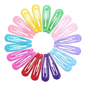 Colorful candy-colored metal BB hair clips arranged in a circle on white background