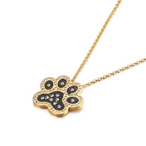 Golden necklace with a crystal-encrusted paw print pendant on a clean white background