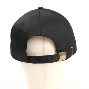 Detail view of cotton baseball cap back with adjustable strap and metallic buckle