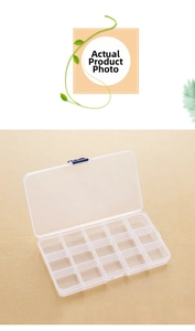 Macro detail of a 15-compartment clear plastic storage box with a blue secure snap latch