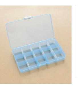 Detailed interior of the 15-compartment blue translucent plastic organizer box open