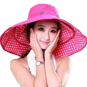 Women's wide brim sun hat in rose red with white polka dot lining for UV protection
