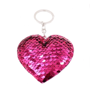 Double-sided rose red heart sequin keychain with reflective finish on white background