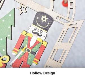 Detail of wooden nutcracker Christmas ornament with hollow carved pattern and star