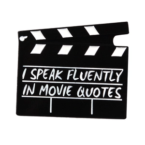 Movie clapperboard enamel brooch with I Speak Fluently in Movie Quotes text design