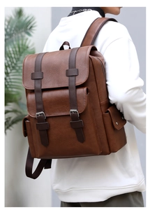 Brown PU leather backpack with buckle flap and drawstring closure shown on model