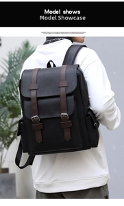 Detail view of the vintage black PU leather backpack showing brown straps and side pocket