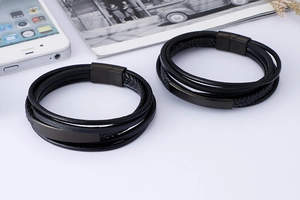 Detail of double braided leather bracelets for men with black metal magnetic clasp