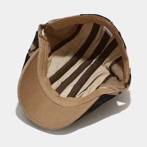 Detail of 100% cotton camo beret interior featuring adjustable buckle and reinforced lining