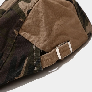 Adjustable metal buckle and camouflage patchwork detail on the back of the cotton flat cap