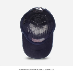 Deep blue cotton baseball cap interior showing USA flag print and adjustable strap