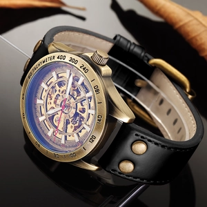 Detail of vintage automatic mechanical watch with skeleton dial and bronze case