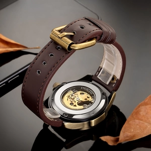 Classic automatic mechanical watch with brown leather strap and bronze stainless steel case
