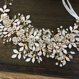 Detail of bridal headband with white metal leaves and crystals on gold wire