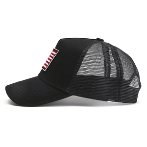 Detail of black trucker hat showing breathable mesh and red-white striped side embroidery