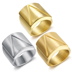 Detailed view of wide band rings with triangular grooves in gold and silver finishes