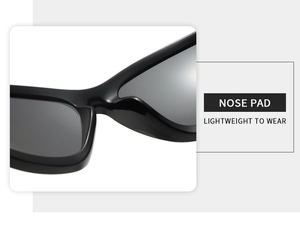 Detail view of lightweight integrated nose pads on black Y2K futuristic wrap sunglasses