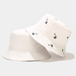 White cotton bucket hat with green coconut tree embroidery for outdoor sun protection