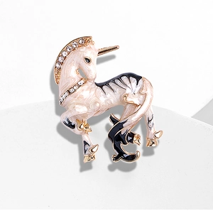 Retro unicorn brooch with white enamel finish and sparkling crystal rhinestones