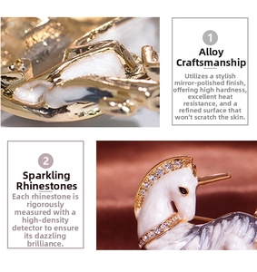 Detail showing white enamel unicorn brooch with gold finish and sparkling rhinestones