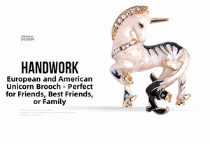 Detail of unicorn brooch with golden metal base, white enamel, and zircon inlay