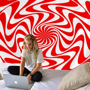 Detail of red and white spiral tapestry with vibrant psychedelic geometric pattern texture
