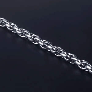 Detailed macro shot of silver stainless steel thick twisted chain link bracelet texture