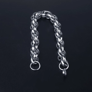 Detailed close-up of a thick silver titanium steel chain bracelet with a heavy link texture