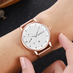 Women's rose gold Milanese mesh strap quartz watch with a white dial and date window
