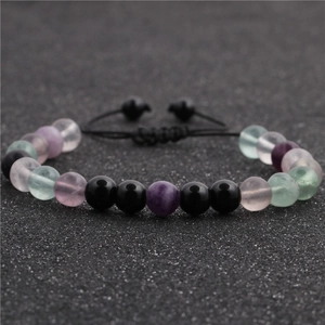 Adjustable beaded bracelet set featuring purple, pink, green, and black stones on woven cord