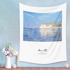 Artistic detail of Monet seaview tapestry hanging on a blue wall with a white vase