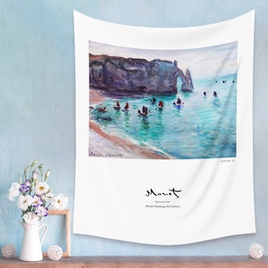 Detailed view of Claude Monet art tapestry hanging on a blue wall with home decor
