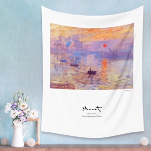 Detail view of Monet Impression Sunrise tapestry on a blue textured wall with home decor