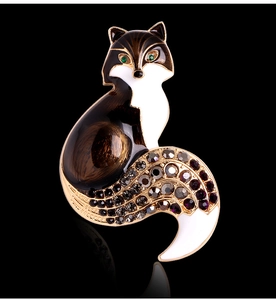 Macro shot of a vintage fox brooch with brown enamel and sparkling crystals