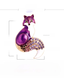 Detail view of fox brooch with purple enamel finish and rhinestone encrusted tail