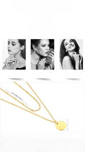 Detail view of gold stainless steel layered necklace with flat circular pendant and beaded chain