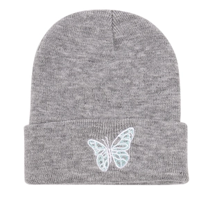 Detailed close-up of blue butterfly embroidery on a grey ribbed knit beanie hat