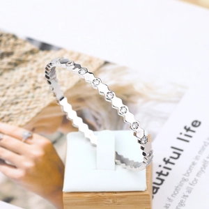 Macro shot of silver hexagonal geometric bracelet with sparkling pave-set cubic zirconia