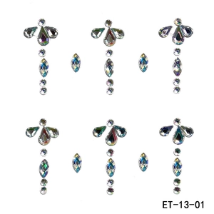 Macro shot of ET-13-01 iridescent AB rhinestone adhesive face jewels in teardrop and round shapes