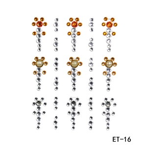 Detail view of 81 self-adhesive facial rhinestones in orange, white, and pearl tones