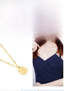 Close-up of Elizabeth coin pendant and pearl chain detail on stainless steel necklace