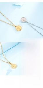 Macro detail of Elizabeth coin pendant featuring gold and silver embossed relief textures