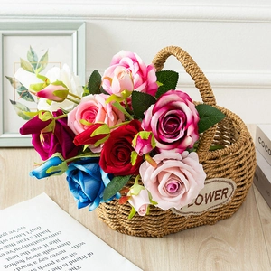Detailed view of artificial rose bouquet in a woven flower basket for home decor