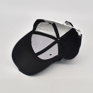 Interior view of black and white graffiti baseball cap with adjustable silver metal buckle