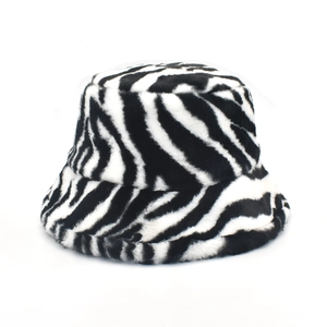 Winter cow pattern faux fur bucket hat with warm plush material in black and white stripes