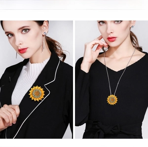 Detail of sunflower brooch with rhinestones worn as a stylish necklace and pin on clothes