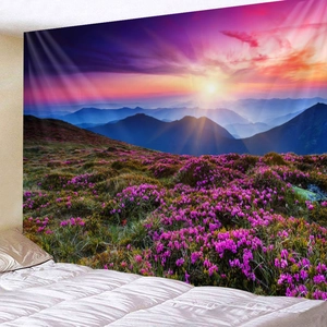 Detailed view of large tapestry showing purple flower field and sunset over blue mountains